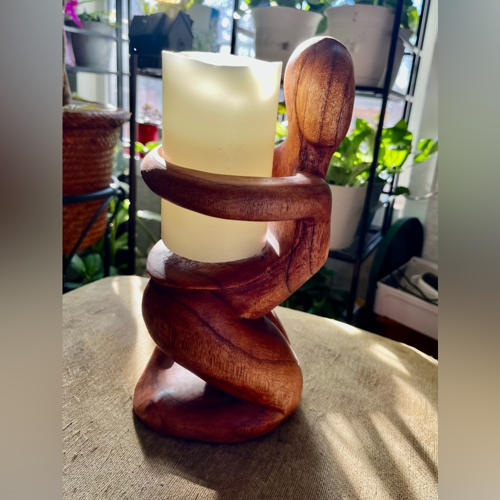 Wooden carved wine bottle holder & beautiful art accent piece.